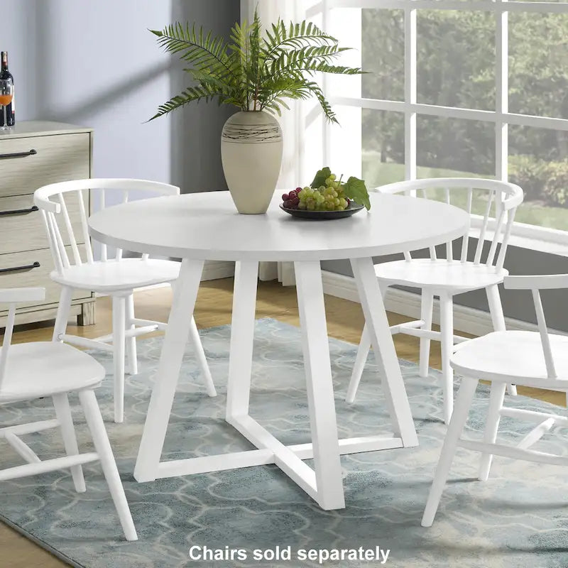 Table à manger ronde blanche moderne avec piètement croisé en tréteau