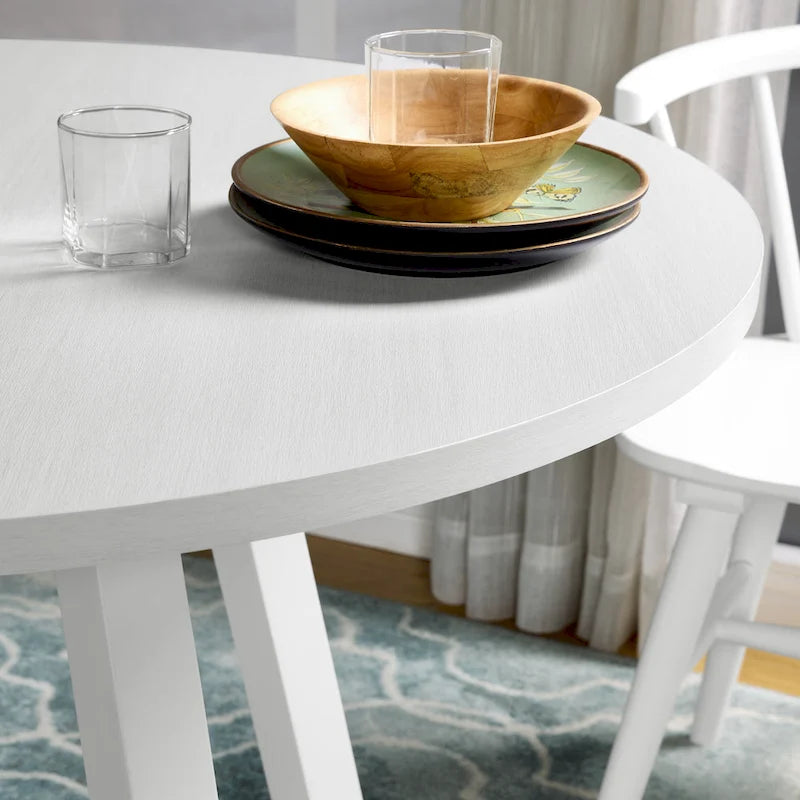 Table à manger ronde blanche moderne avec piètement croisé en tréteau