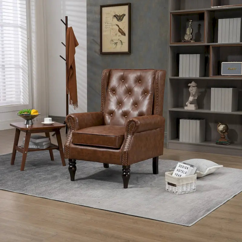 Fauteuil d'appoint capitonné à dossier haut avec garniture cloutée et pieds en bois massif