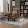Fauteuil d'appoint capitonné à dossier haut avec garniture cloutée et pieds en bois massif