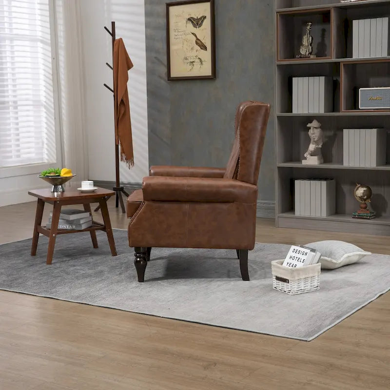 Fauteuil d'appoint capitonné à dossier haut avec garniture cloutée et pieds en bois massif